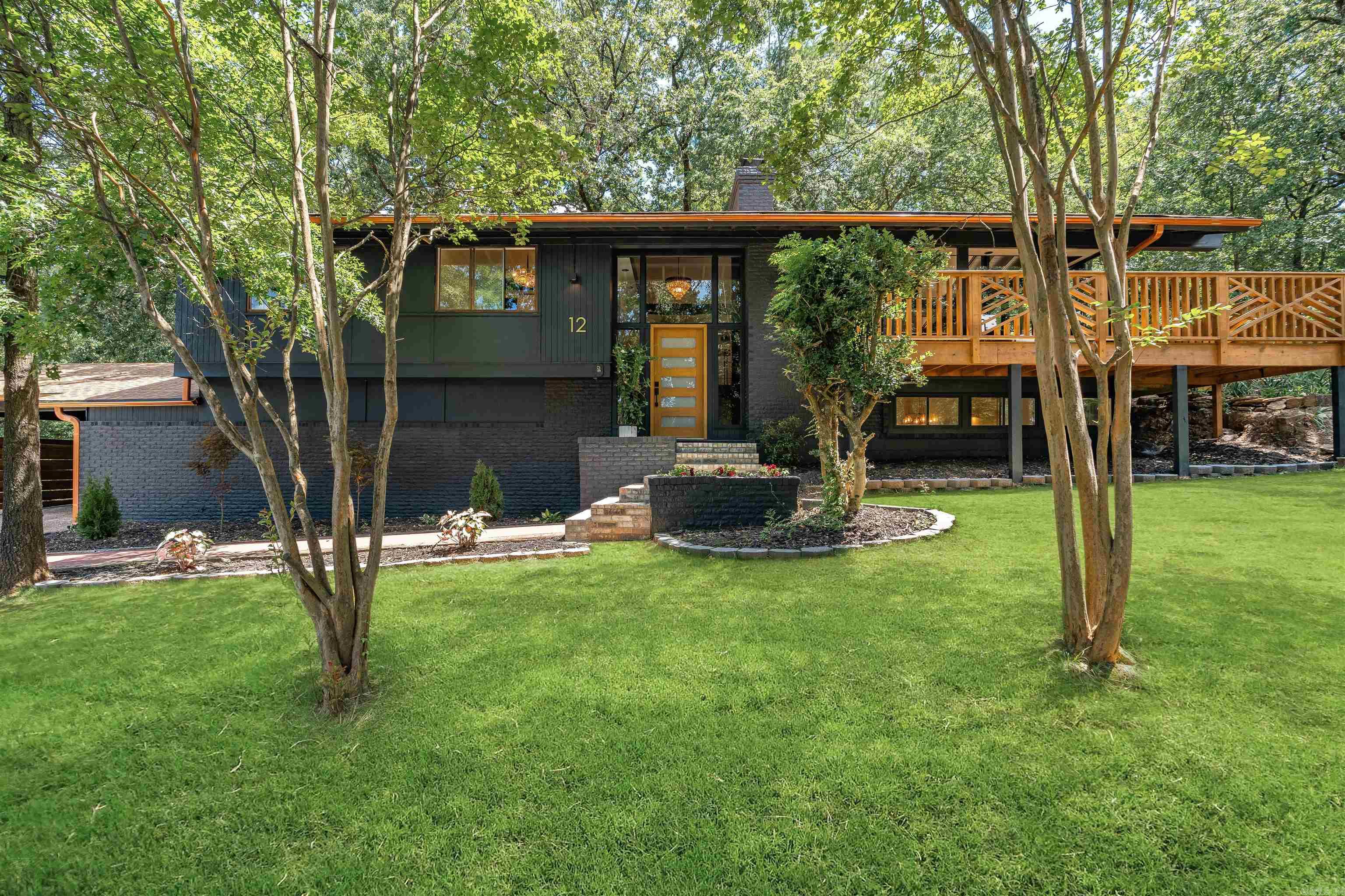 Mid-Century Modern Masterpiece in the heart of Fort Smith, perched gracefully into a serene hillside on a quiet cul-de-sac, this one-of-a-kind, fully restored, home is the perfect blend of architectural charm and contemporary luxury surrounded by lush, mature landscaping. Professional photos, video, and additional details will be posted soon! There’s no place like HOME!