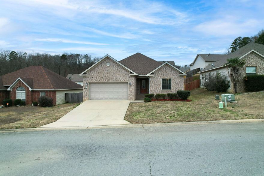 ** Back on the market! Not fault of seller**Impeccably cared for, this charming residence boasts brick front exterior, Offers three bedrooms with two full baths. The owner's suite features a generously sized bedroom, along with a private bathroom showcasing a separate tub and shower. Abundant natural light fills the living spaces, enhancing the overall warmth of the home. Step outside to a covered back porch, and a fenced backyard, creating a perfect blend of indoor and outdoor living spaces.