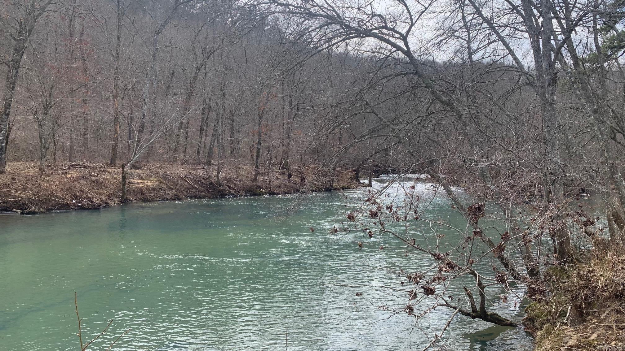Did someone say CREEK?! Discover the endless possibilities of this beautiful 16 acre property nestled alongside a beautiful year-round creek. Enjoy the convenience of a well, city water, and septic system already in place. Embrace the freedom to build or develop the property as you see fit. Whether you love hunting, fishing, or swimming this property offers it all. Ideal for a small farm. This property has a garage in good condition could be used for storage even a work shop, along with a barn and storage shed. There is also a wood furnace that could still be used. So many possibilities with this unrestricted and beautiful CREEK property. Call today to set up your own private showing to see it for yourself.