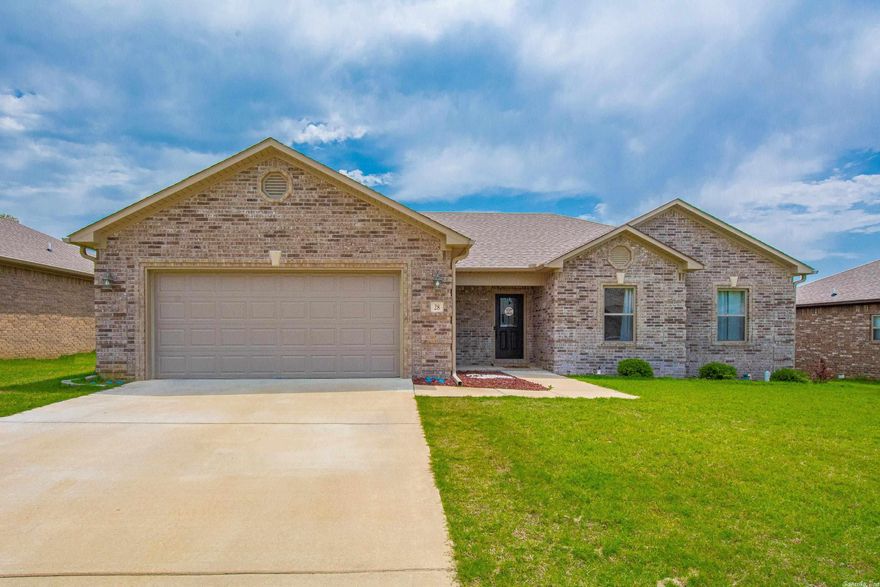 4 Bedrooms 2 Baths very open floorplan. Master Bedroom is separate from the other 3 Bedrooms. Huge master bathroom with vanity, spacious shower, separate soaking tub, and an amazing master closet. Kitchen is open to living room with coffered ceilings, large kitchen island with breakfast bar, granite counters, farm style sink, shaker cabinets. Lots of counter and cabinet space. Backyard is level, fully privacy fenced, with an oversized covered back patio. Refrigerator, washer, and dryer stay. See Remarks.