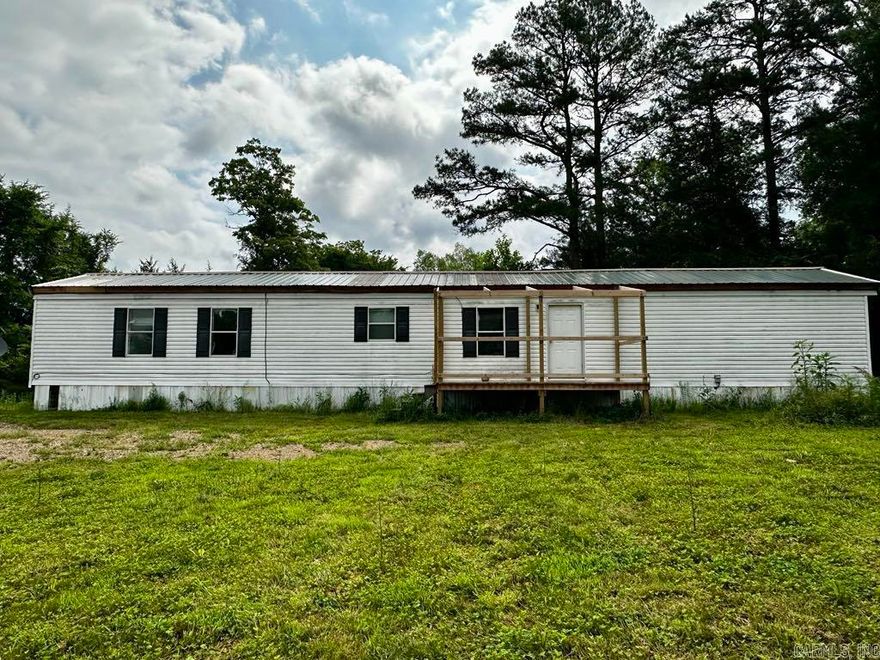 This won't last long! Single wide mobile home on 0.7 acres m/l, approximately 2.5 miles to the turn off for Wolf Pen Gap ATV Trails! Included in the property is another mobile home (has no value) and a garage. New septic system was recently installed. There is a well on the property but is on city water. Beautiful little peach orchard that produces peaches every year and an apple tree! New metal roof installed on the mobile home. Sky lights in the bathrooms to bring in the natural light. Highway frontage but still quiet and peaceful. Fenced on 3 sides. Take a look today!