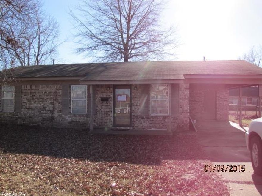 Super deal on well kept home in Trumann.  Brick exterior home with 950 SF has 3 bedrooms and 1 full bath.  Eat in kitchen with sliding glass door opens to the chain link fenced backyard that has a storage shed.  Covered parking for one with extra storage room off the carport.