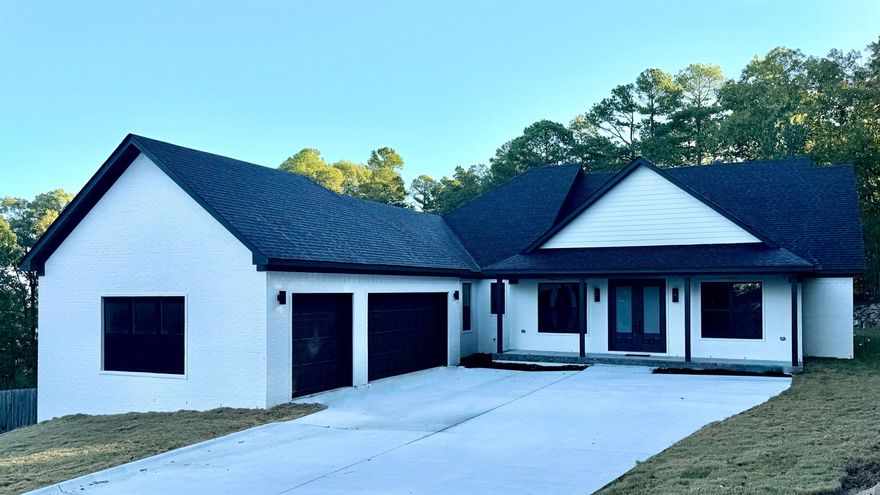 Welcome to Majestic Point—Maumelle’s premier subdivision and the highest elevation in town, offering breathtaking views from every angle. This brand-new construction home is perfectly positioned on an exceptionally level lot in a private cul-de-sac, blending luxurious design with thoughtful functionality.  Step inside to discover top-of-the-line finishes throughout, including soft-close cabinetry, premium appliances, and an elegant electric fireplace that creates a warm, inviting ambiance. The walk-in Butler’s pantry is a dream for entertainers and chefs alike, offering abundant storage and workspace.  Every bedroom features spacious, walk-in closets, ensuring comfort and convenience for all. The primary suite is a true retreat—offering a seamless connection from the spa-inspired bath directly to the laundry room, an innovative layout designed for ease of living.  Enjoy evenings on the covered patio beside the gas-burning fireplace, taking in the unparalleled views that only Majestic Point can offer. The oversized garage provides plenty of room for vehicles, storage, or even a workshop.  This newly built masterpiece defines Maumelle living at its finest!