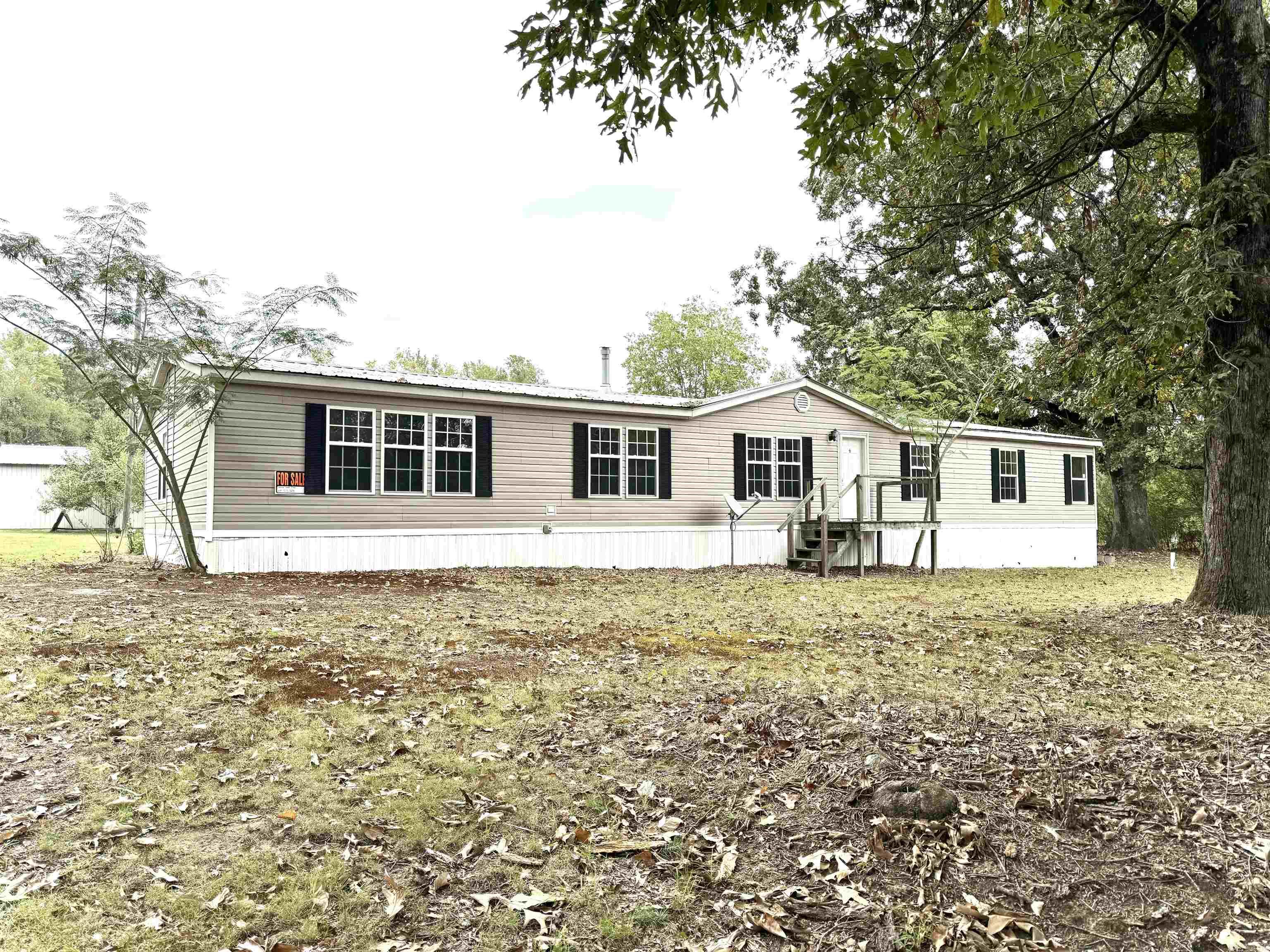 Located on over two acres, this three bedroom and two bath property offers country living and lots of square footage for everyone to enjoy! With plenty of storage in the kitchen, built-ins in the living room and his and her closets in the master bedroom, you will have the opportunity to stay organized. The shop has plenty of room to store your boat, hunting gear or outdoor toys you need. AGENTS: Please see remarks.