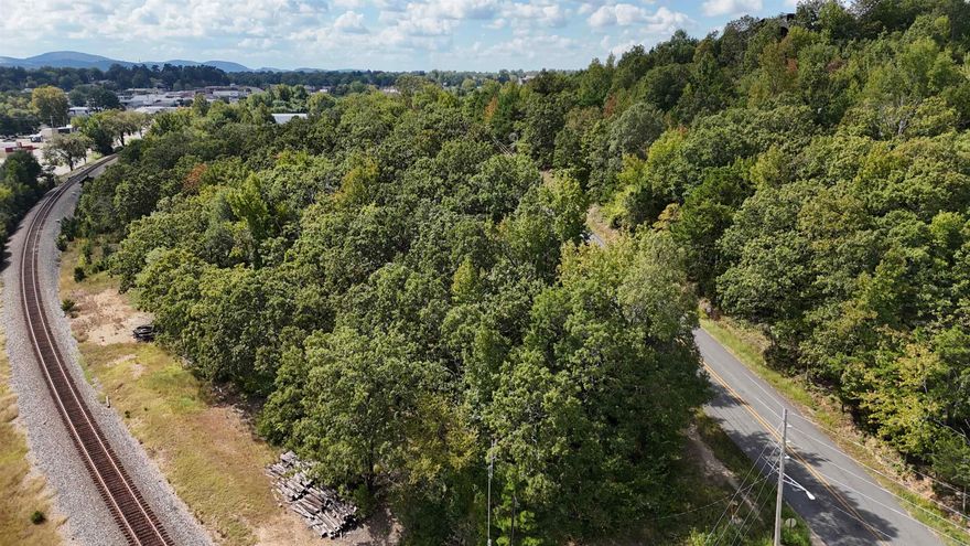 Great commercial Potential.  Would need to be zoned for your adventure. Overlooks part of Mena. Creek Corners property.