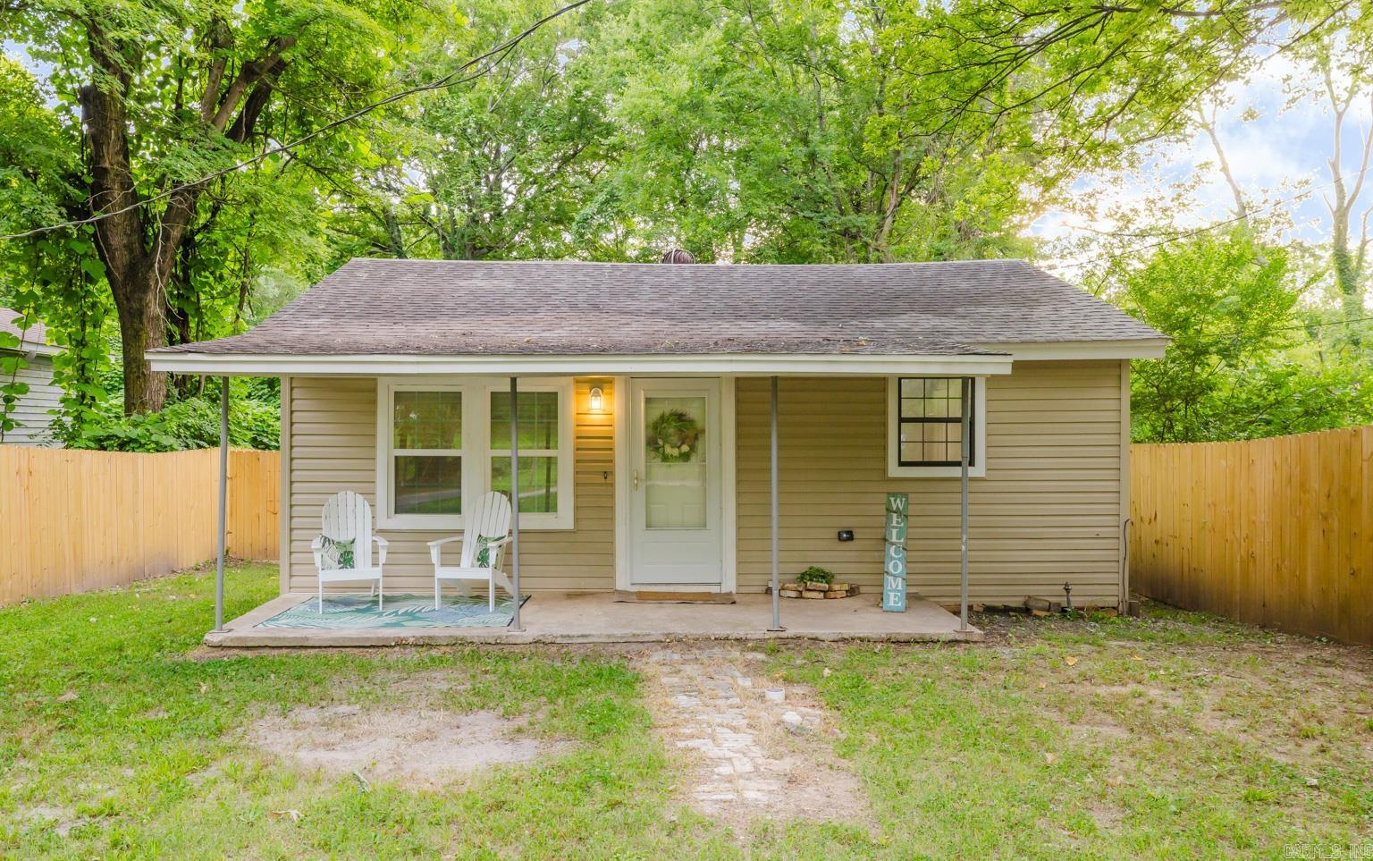 This beautifully renovated 2 BR, 1 Bath property sits just minutes from downtown Benton. With modern amenities and classic finishes, you can enjoy the ambiance of recessed lighting, the comfort of central A/C, and the elegance of crown molding, all new LVP flooring throughout, and granite countertops. The home is also equipped with a washer & dryer that conveys. The kitchen features a large single bowl sink and all new appliances that convey. It also has a lazy susan in the corner cabinet and a nice pantry. The large backyard is fully encompassed with a 6-foot brand new privacy fence that extends to each side of the home, offering maximum privacy. Fiber internet is now available in the area. This adorable cottage is move-in ready & waiting on its next owner!