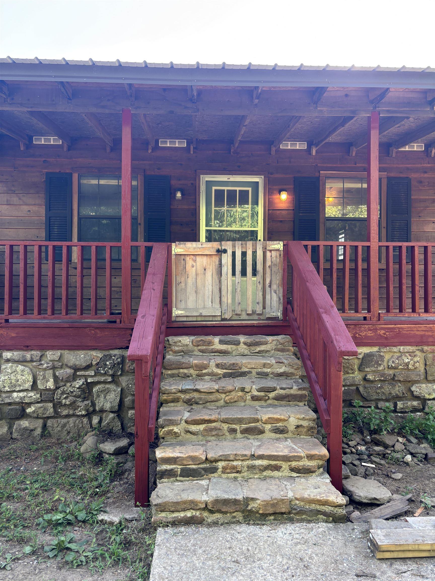 Cozy Creekside Cabin Retreat – 2 Bed, 1 Bath – Nature Lover’s Dream! Welcome to your perfect escape nestled in nature! This 2-bedroom, 1-bath cabin offers rustic charm, peace and the soothing soundtrack of a flowing creek right out front and enjoy the garden right outside your back deck. Cozy up to the nice wood stove/fireplace. Whether you're looking for a weekend getaway, a vacation rental opportunity, or a full-time hideaway, this property will suffice for either. Get ready to unplug, write your novel, or just breathe deep, this place feels like home the moment you arrive. This property has municipal water and includes 2 wells that could be switched over if preferred. Located about 3 miles from the Oark cafe.