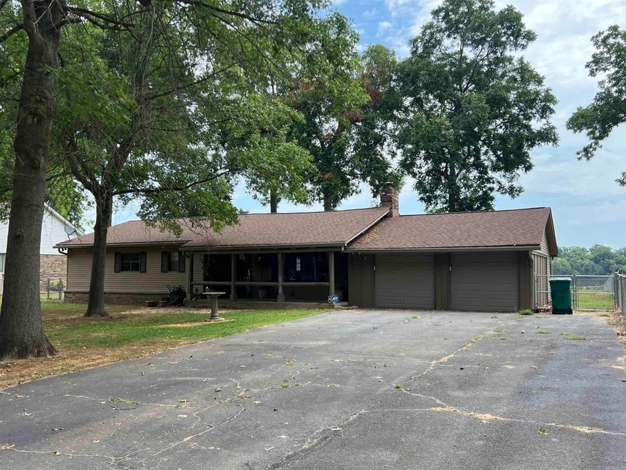 Discover the tranquil beauty and endless possibilities of this stunning riverfront property. Imagine waking up in your log home to the soothing sounds of the harbor and enjoying breathtaking views from your own backyard.  Enjoy the open concept living space with cathedral log ceilings and walls, wood burning stove, two spacious bedrooms and a fabulous sunroom to sip your coffee and watch the water.  This is more than just a home it's an escape and a place where memories are made.  It has unmatched river access boasting 100 ft of prime river frontage and provides direct access to the Arkansas River. There are scenic views of the harbor and surrounding natural beauty from almost every room and the expansive yard, private dock, and outside gazebo offers ample space for entertaining, gardening or simply relaxing by the water. There is an outdoor storage room and a fish cleaning area for convenience.