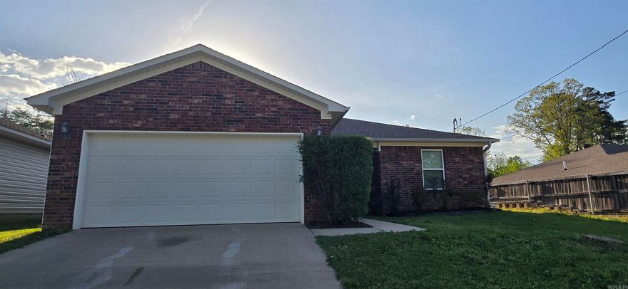 Immaculate executive home in Benton school district! New carpet, warm hardwood floors in living room and halls, tile in kitchen, laundry, and bathrooms. Crown molding, granite countertops, an abundance of custom cabinets to store all your culinary needs, and 2" faux wood blinds through out. Linen closets in both bathrooms as well as double sink vanity in primary suite bathroom.  Floored attic and fenced back yard add to the appeal of this like new home!