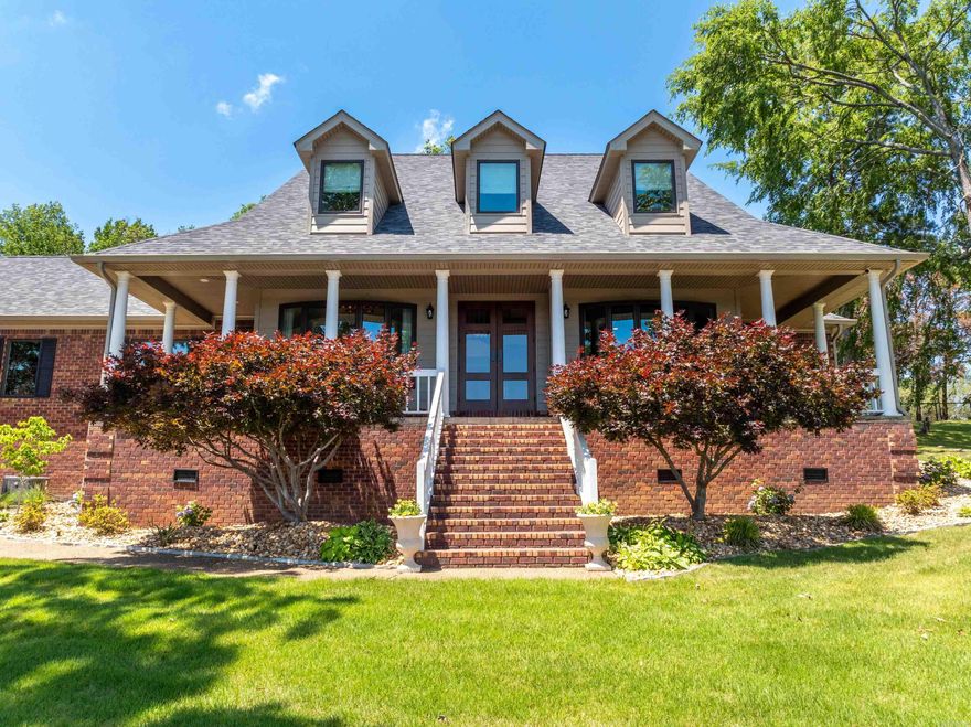 Luxury living awaits in this remodeled home in gated Stonegate Shores with breathtaking Lake Hamilton views! Situated on a premium lot, enjoy direct lake access and your private boat slip—just minutes by water to 6 waterfront restaurants. Inside, the open-concept layout is filled with natural light, sleek tones, rich wood accents, and high-end finishes throughout. The chef’s kitchen features Thermador appliances, a large island, custom cabinetry, and flows seamlessly into the living and dining areas. The smart home system controls lighting, temperature, security, and whole-house audio. The primary suite and multiple living areas offer comfort, tech, and elegance in every detail. Enjoy community amenities: clubhouse, tennis, basketball, and boat storage. Recent updates include new roof, siding, and soffit (2024), heat pump, and HVAC. Garage is heated/cooled but not in SF. Hunter Douglas shades, custom drapes, and refrigerator convey. This home is more than a place—it’s a lifestyle.