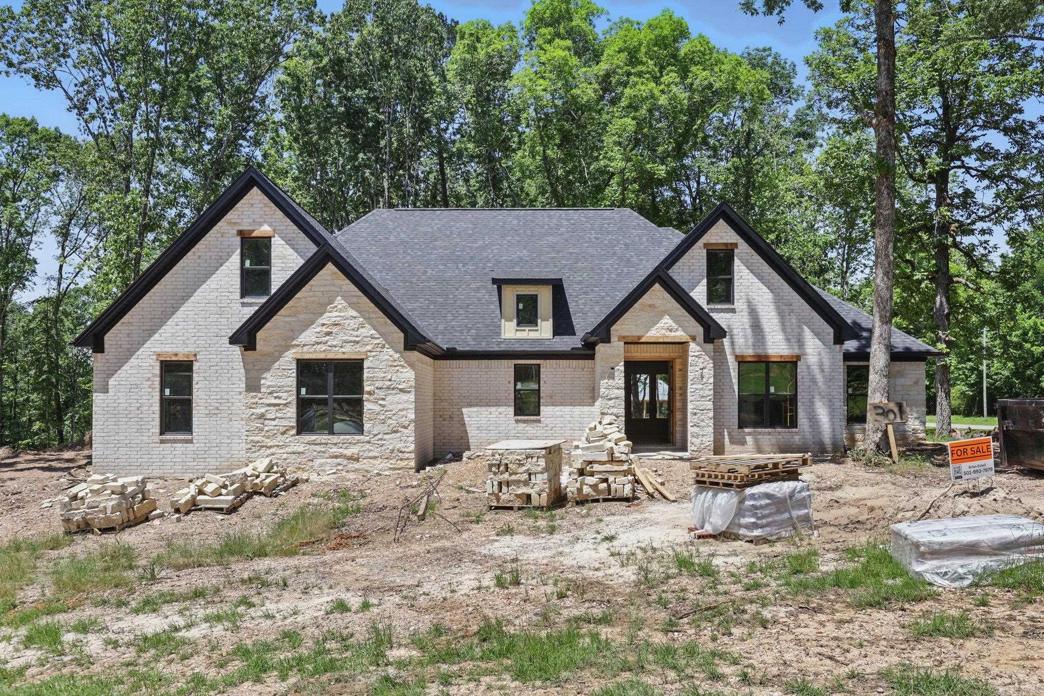 Sitting on over an acre in the gated community of Big Rock Estates, this traditional home offers a quiet country feel minutes from town. Four bedrooms, 2-and-a-half baths, office, and bonus room. No details were spared with natural limestone, brick, cedar accents and tongue & groove ceilings. As you enter the home you are greeted by a home office/craft room/playroom and the fabulous open living space. The kitchen offers a dining/eat-in area, large island featuring quartz counters and bar seating and large hidden pantry providing tons of storage. The primary suite is just off the kitchen which offers tongue and groove ceiling and an on-suite with walk-in glass shower, soaking tub and dual vanities. The walk-in closet offers ample space for all seasons. The secondary bedrooms are split from the master and share a bathroom. The large bonus room can be used as an extra bedroom, media area or entertainment area. The covered patio is a perfect place to relax and offers tongue and groove ceiling, TV outlets and access to propane for all your cooking needs. The oversized 3-car garage offers plenty of space for your vehicles as well as your toys and tools.