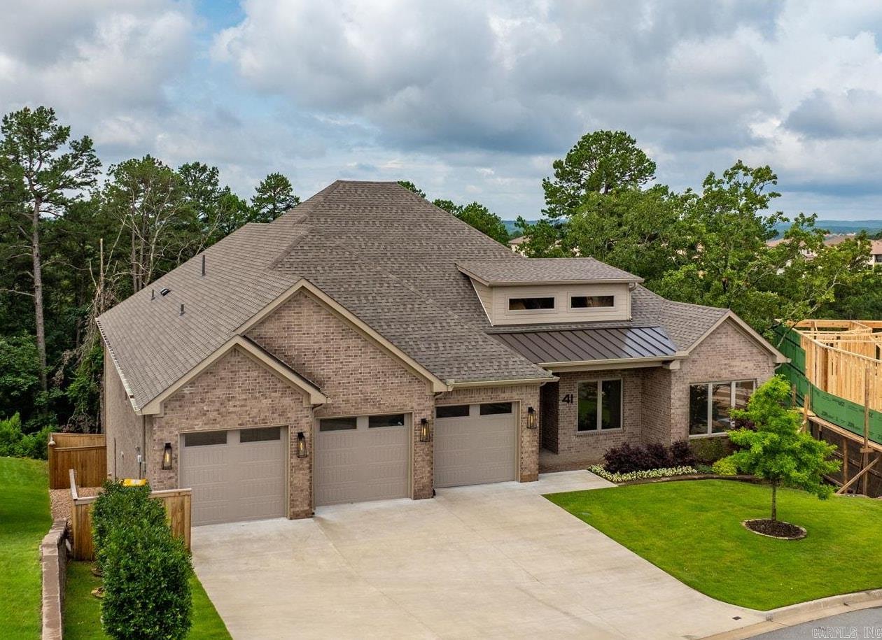 Gorgeous newer build, completed in 2024 by Dillon Homes. This 4 bedroom 4.5 bath home features a large open concept chef's kitchen and pantry. There is double wide refrigerator & freezer, 48" gas range, double ovens, a gorgeous wet bar with ice maker & drink cooler. Plenty of built ins! When entering the home from the garage there is a large mud room that leads into the oversized laundry. The primary bedroom is on the main level with an unbelievable closet that connects to the laundry room as well. The primary bath is to die for!! Downstairs are two more en-suite bedrooms plus a bonus living space. Guest en-suite bedroom on the main level next to the designated office. The covered outdoor patio is fantastic with a fireplace and gas grill. 3 car garage (with electric car charger) with stairs leading to a huge storage space. Wonderful finishes include Pella windows and doors and top notch appliances. This cul-de-sac lot has a private green space to the rear, fenced in yard and upgraded landscaping. Alarm & is prewired for audio. This is a wonderful home!