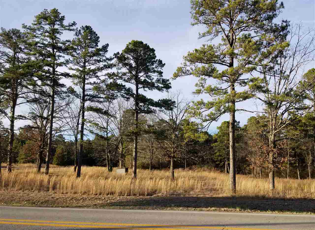 Developers Dream.   Almost 200 feet of frontage on Greers Ferry Lake in addition to road frontage on Highway 25B.   1/2 mile from Dam Site Maria and 1/4 to Heber Springs Airport.     Water, Sewer and electric on property or available