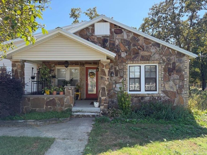 Welcome home to this charming 4-bedroom, 2.5-bath retreat set on one and a half acres. Featuring a durable metal roof, inviting stone front, and welcoming front porch, this spacious home blends timeless character with modern comfort. Inside, you’ll find generous living areas ideal for gathering and everyday living. Enjoy peaceful mornings or relaxing evenings on the back deck, surrounded by nature and serenity. The AC is a package unit and replaced in 2022. The detached 2-car garage adds convenience and extra storage. The septic was entirely replaced in 2018. Offering a true country feel just minutes from town, this home delivers the perfect balance of privacy and accessibility. Fridge in kitchen will convey. No seller property disclosure available.