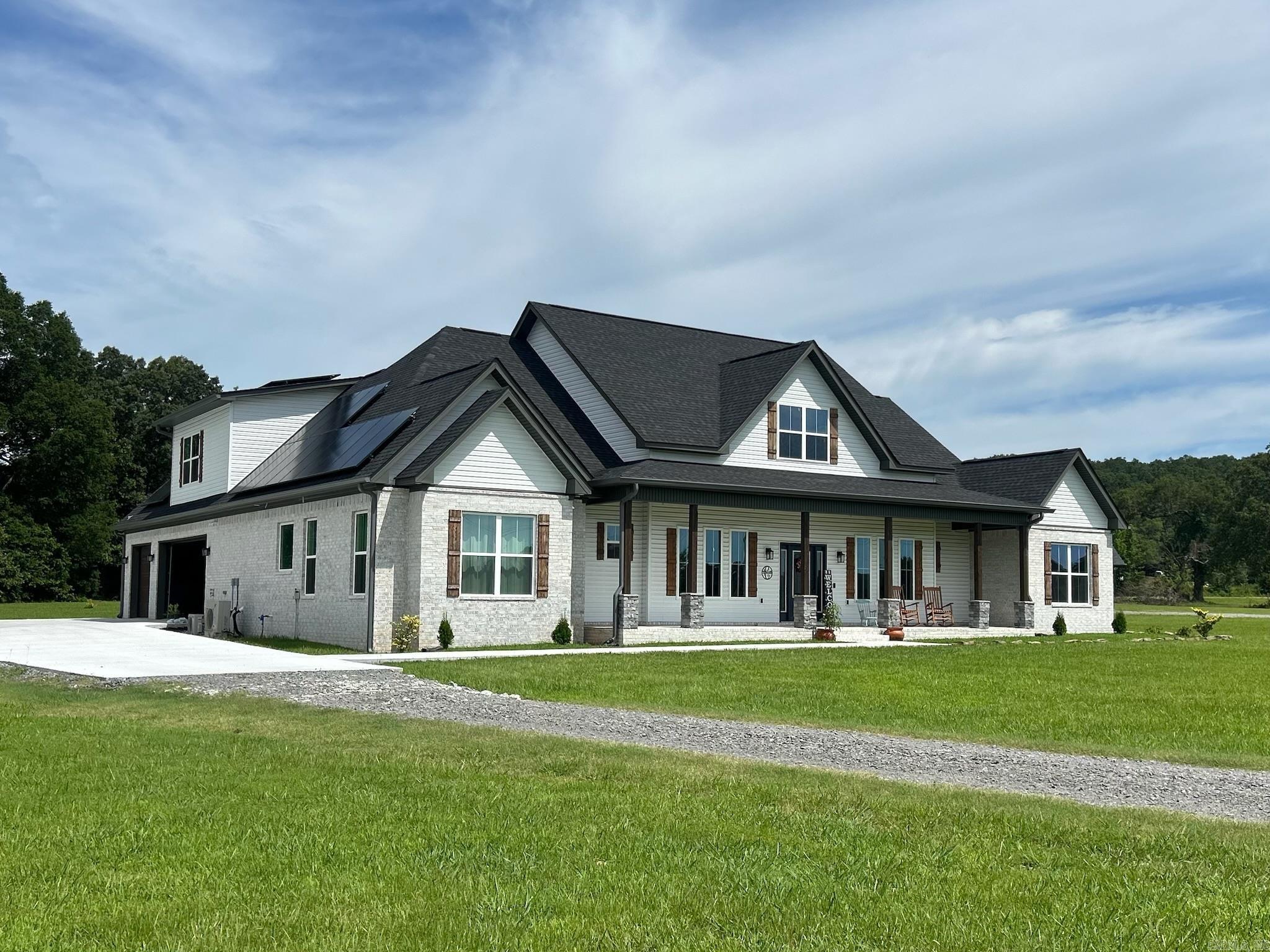 Welcome to this stunning custom-built modern farmhouse, perfectly situated on 5 acres of peaceful countryside. This spacious home features 4 bedrooms, 3.5 bathrooms, a dedicated office, a large bonus room, and a secure safe roomāoffering both luxury and peace of mind. The open-concept layout is filled with natural light and upscale finishes throughout. Enjoy relaxing on the expansive covered front porch or take advantage of the ample outdoor space for a future shop, pool, or garden. Energy-efficient solar panels add modern convenience, while the serene setting provides the privacy you've been searching for. A rare find that truly checks every boxācome see it for yourself!