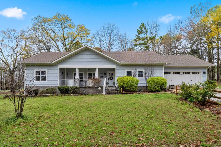 Welcome home to this beautifully updated farmhouse chic retreat that's truly move-in ready! This meticulously kept home features an inviting open floor plan perfect for everyday living and entertaining. The stunning kitchen is the heart of the home, complete with granite countertops, a classic farmhouse sink, oversized breakfast bar, white cabinetry, and a spacious pantry. The thoughtfully designed layout offers privacy with primary suite located on the opposite side of the home, creating a peaceful retreat.  You'll also appreciate the large laundry room with a utiltity sink, making everyday tasks a breeze.  Step outside and enjoy the space and possibilities of approximately 3 acres, along with the convience of a two-car garage and the added peace of mind of a whole-home generator. Call for your private showing today!
