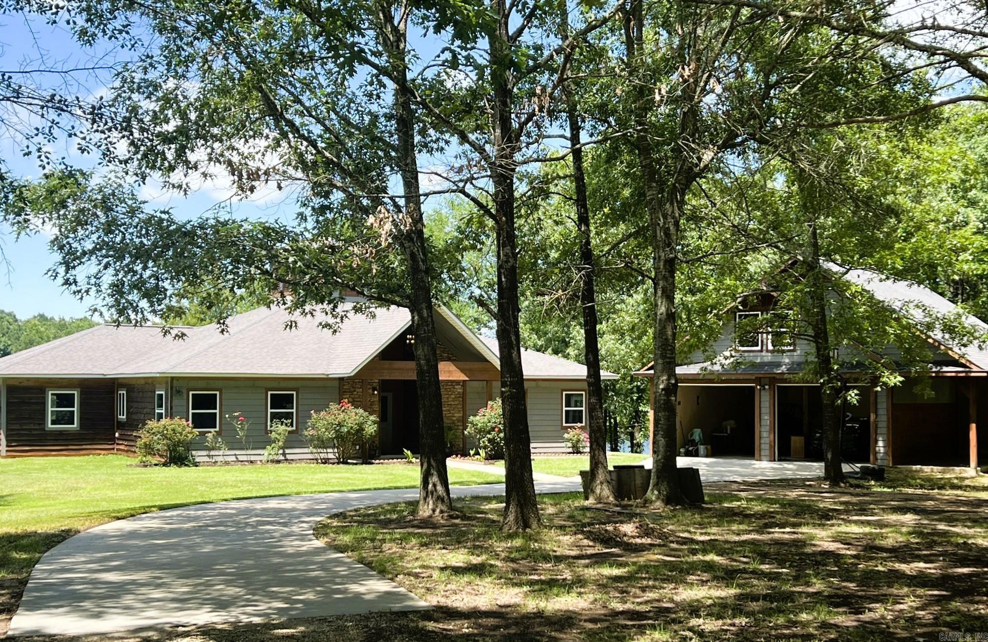 Current Owner built this home w/ the intentions of it "not moving" & it hasn't. There are 25 - 12" diameter piers in the ground, 2' x 2' footings around the perimeter & 2' x 2' cross beams, front to back & side to side under the slab. The garage has a wrap-around porch on one side & the back, it has an 18 x 40 Bonus Room upstairs that is unfinished.Plumbing has been roughed in for a bath upstairs. The house is on city water. The home has 2 - 2 1/2 ton HVAC units (electric). 1 of the outside units is 1 year old, the other & the inside units are original. Water heater is original but the thermostat & heating element were recently replaced. Roof-original. Pool deck will remain but the above ground pool is being removed, non-functional. All appliances are original with the exception of the microwave. A new one is being installed. Kitchen counter-tops are Quartz. Main Bedroom & Eating area have lake views. The main bath has a walk-in shower, large 6' soaker tub, walk-in closet & double sinks. The lake is approx 9 acres of the 50+ acres. It has been stocked w/ Catfish,Bream, Bass (Pure FLorida & F1) & Crappie. There is a well for watering yard or garden, washing cars, etc.