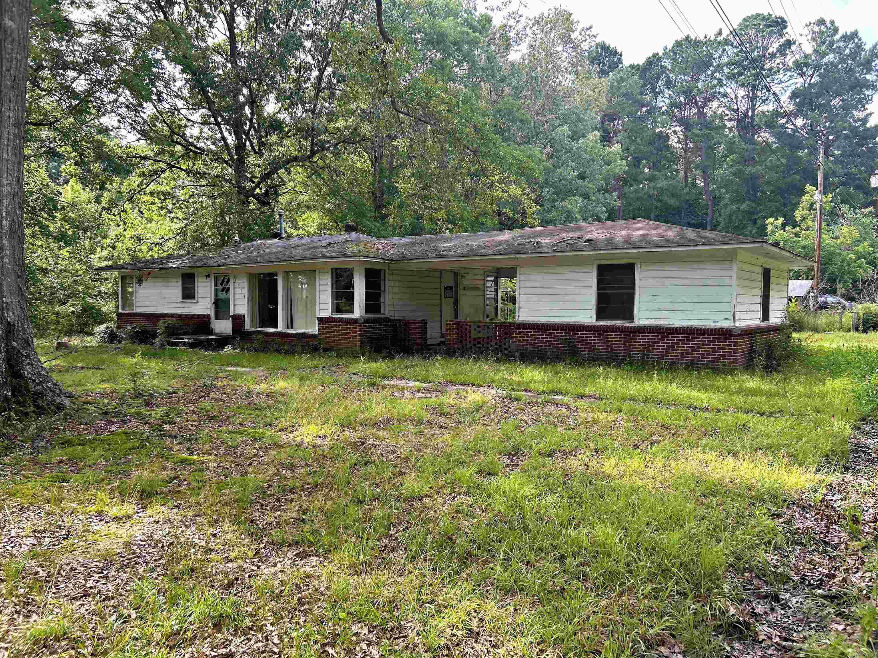 Fabulous Fixer Upper with fenced in back yard and side storage off of the carport.