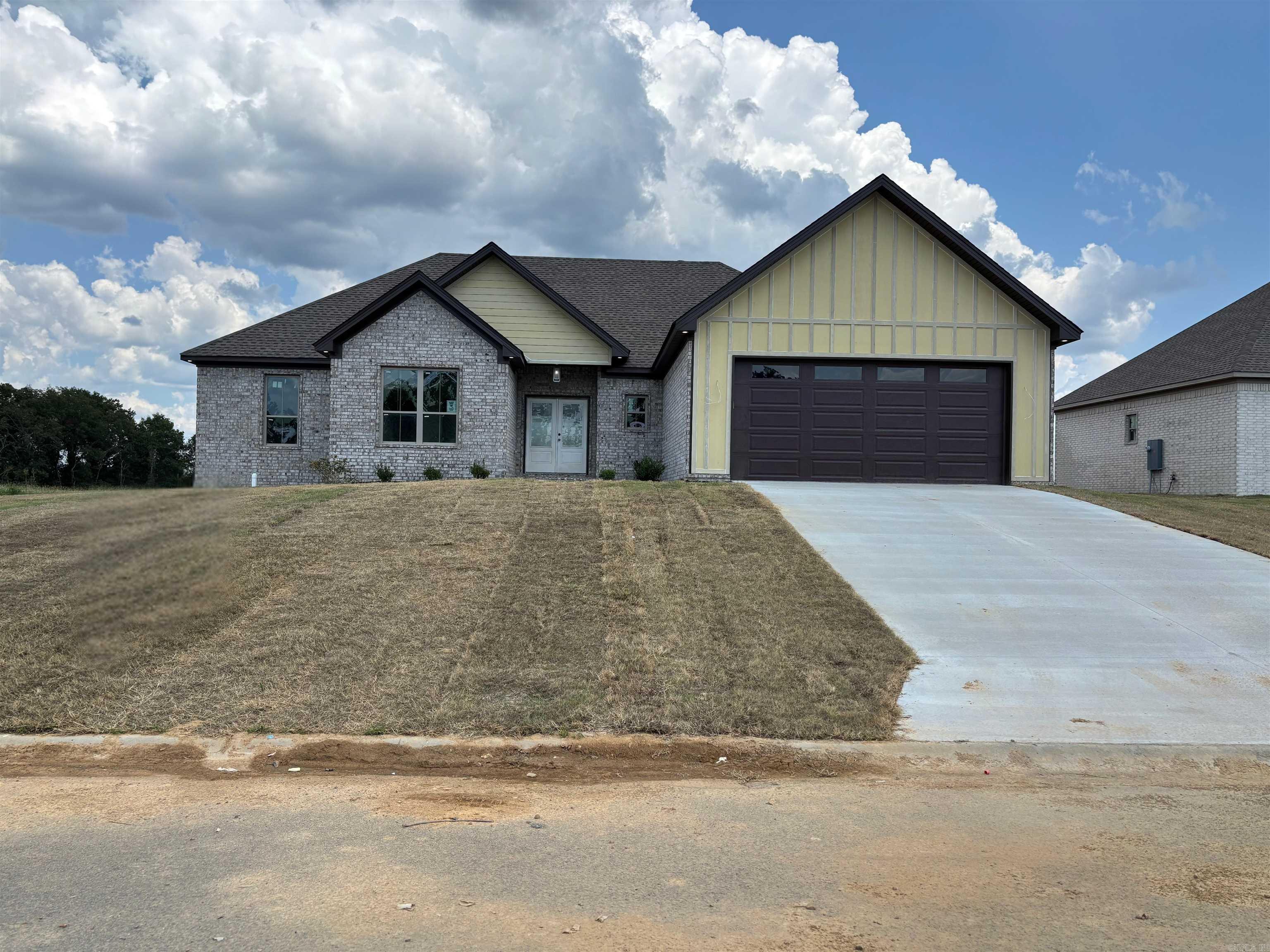 New construction home with 4 beds, 2 bath, approx. 2109 sq ft. There will be a community pond behind this home. This home is going to be a split floor plan home, with an open concept. When you enter the home from the gorgeous front porch you will walk into the living room with the kitchen/dining room and master to the right and guest bedrooms and bathroom to the left. There will be stunning brushed nickel accents throughout the home, with an accent wall in the dining room. Paint colors are going to be Alabaster and Greek Villa. This exterior of the home will be brick and board and batten. Estimated completion date August 2025 **Mood Board and floor plans are uploaded in Documents to show what is going in the home.