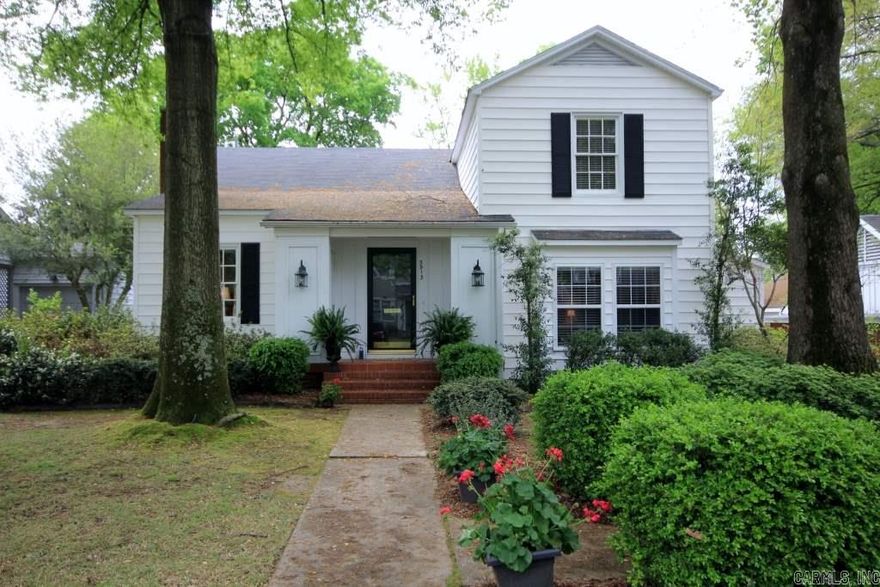 Move right in!  Adorable doll house, formal living with fire place, Den with bar, master main level, new updated kitchen, wolf burner stove, opens to eating area.  Large screened in porch, 3 bedrooms, 1 bath upstairs.  Wonderful backyard.  Hardwood floors everywhere but master closet.  Charming, happy house!