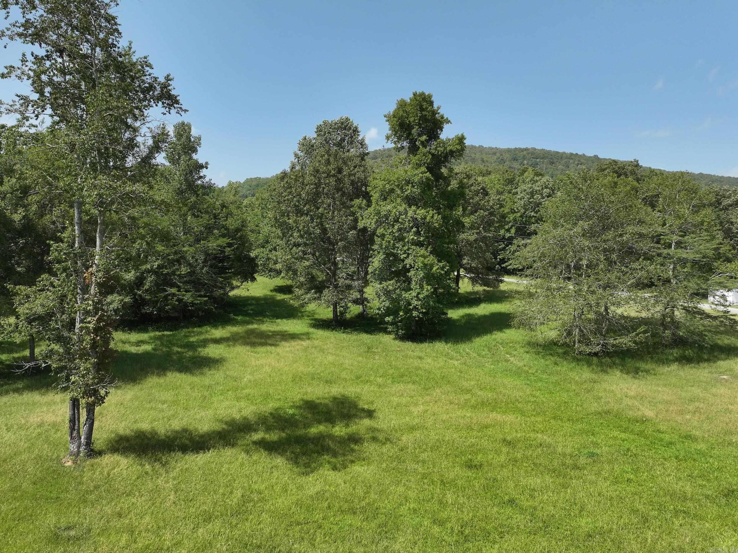 Approximately 3 acres outside the Glenwood city limits with no restrictions. If you're seeking the perfect site for your future home or an investment opportunity, this is it! This parcel features beautiful pasture land with shade trees scattered throughout, making it ideal for a new home build, future livestock, your next homestead, and more. Located near the Caddo River, Lake Greeson, and just a short drive to Hot Springs and other local amenities, this property offers a convenient location close to town while still providing a country feel. Water and electricity are available at the road.