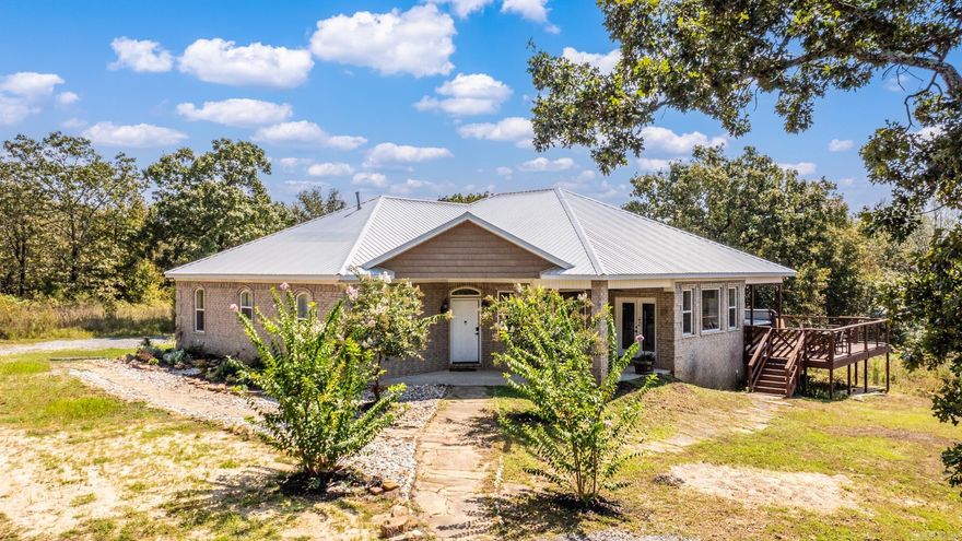 Custom built in 2018, this 3 bed, 2.5 bath home offers 2167SF of stylish living on 3+ acres in the Saltillo community of Faulkner County. Inside, you’ll find 9-ft tray ceilings, a gas fireplace, and a chef’s kitchen with gas stove, butcher block island, and two walk-in pantries. The master suite opens to the wrap-around deck through French doors and features a tiled walk-in shower, jetted tub, double vanities, and two walk-in closets. Two additional bedrooms share a Jack & Jill bath for added charm and convenience. Smart features include Alexa-enabled lighting, Wi-Fi thermostat, tankless water heater, and surround sound inside and out. Thoughtful details like extra shelving, outlets, and spigots add everyday ease. Outside, enjoy the refinished deck, fenced backyard, and stocked pond all with a durable white metal roof, oversized 2-car garage, and total secluded privacy. Don’t miss the full list of features. Schedule your showing today!