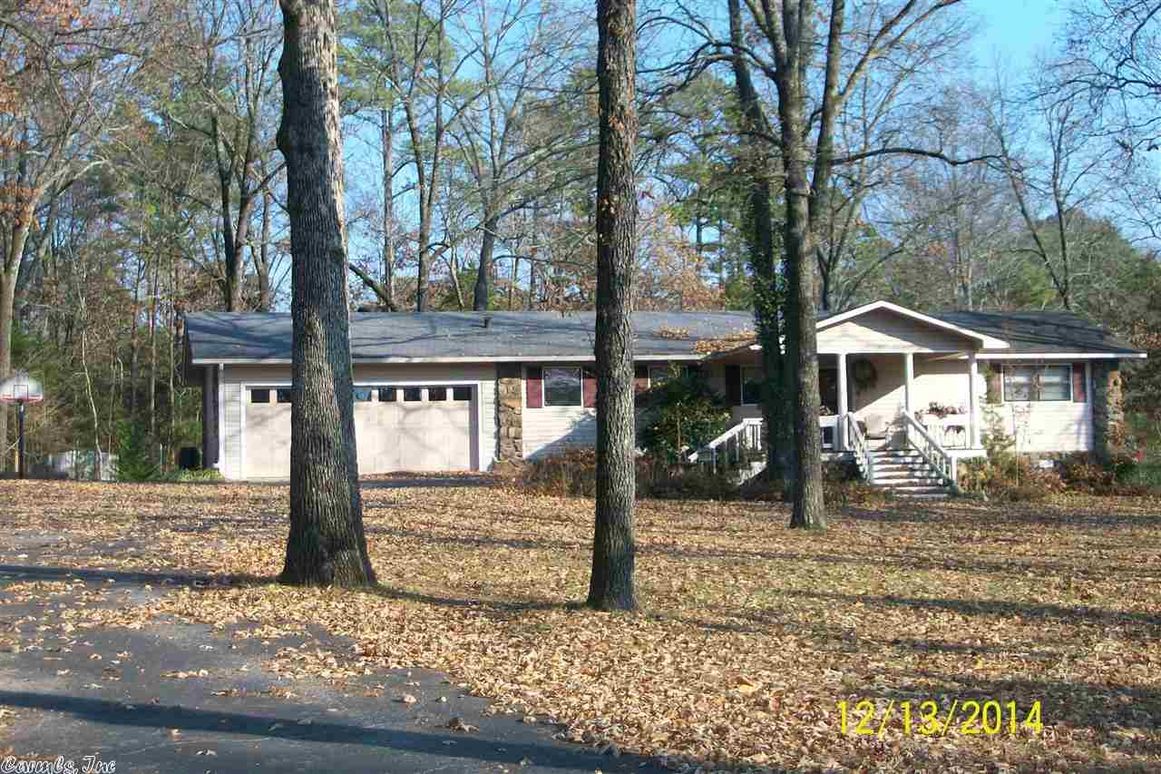 This home is right across the street from the lake! (The Narrows). Perfect getaway home or full-time home for anyone interested in living the lake lifestyle. Lots of nice trees and landscaping, as well as a 2-room, 12x20 utility building with electricity and a small fenced garden area out back. Seller recently installed insulated floors, refinished kitchen cabinets, and revamped both bathrooms. Pretty deck on the back of the home, and beautiful gas fireplace inside. Nice neighborhood on a dead in street.