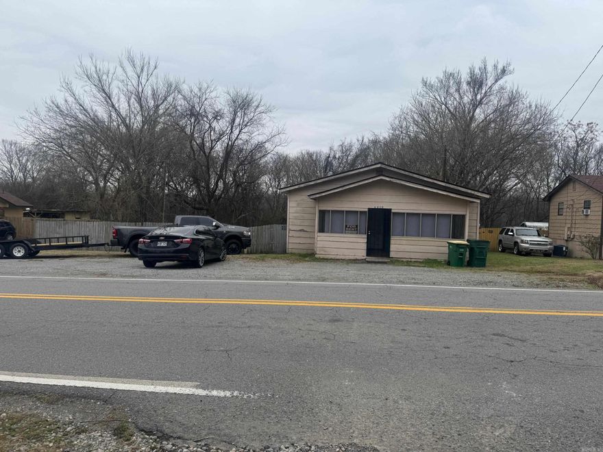 AS IS, WHERE IS investment property on a double lot. Roof replaced 2 years ago. Needs TLC—ideal for investors or rehab buyers.