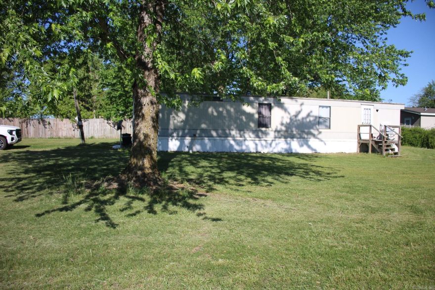 Single wide trailer sitting on a half acre. This lot is very level and sits just off of Hwy 14 S on a paved county road. Perfect starter home, retirement home or get-a-way with 2 bedrooms and one bath. Make this your home of buy as a rental. No restrictions and only 13 miles to the Buffalo National River.