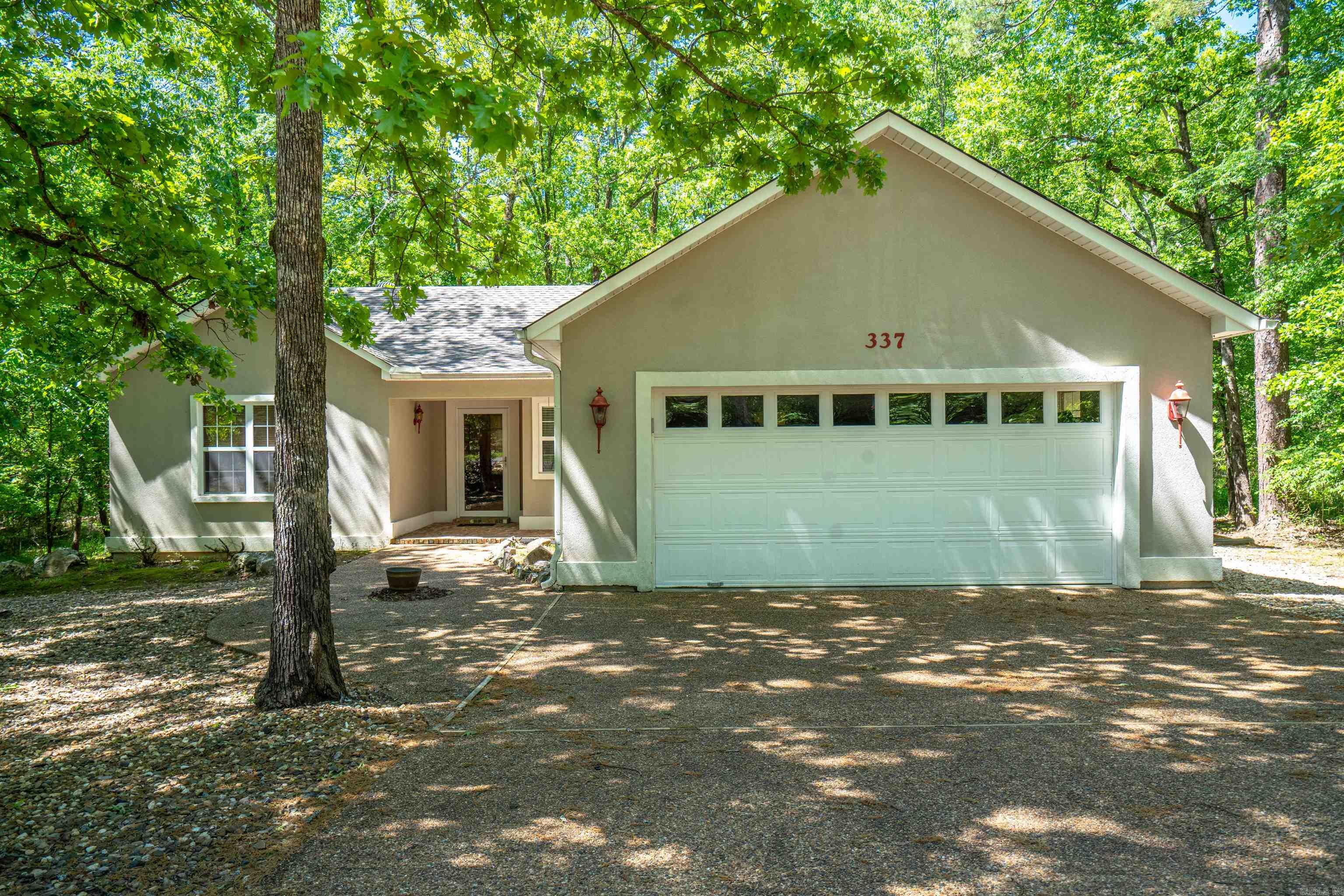 Welcome to your new home! This cute starter or downsizer home is looking for its new owners. Surrounded by nature, this 3bdrm/2bths home is situated on .27 acres. The split bedroom floorplan with owner's suite on one side and 2 additional beds & bath on the other side. The owner's suite is large enough for a king size bed & has plenty of closet space. The kitchen has a small eat-in area with access to the dinning & living. A sunroom towards the back of the home adds additional space for relaxation or entertaining. Enjoy listening to the birds & running brook as you sit on your back porch with your cup of coffee or glass of wine. Seller is offering $3,500 for carpet allowance. Come see this home & bring your offer! See Agent Remarks for additional info. Buyer and buyer's agent to verify all information stated.