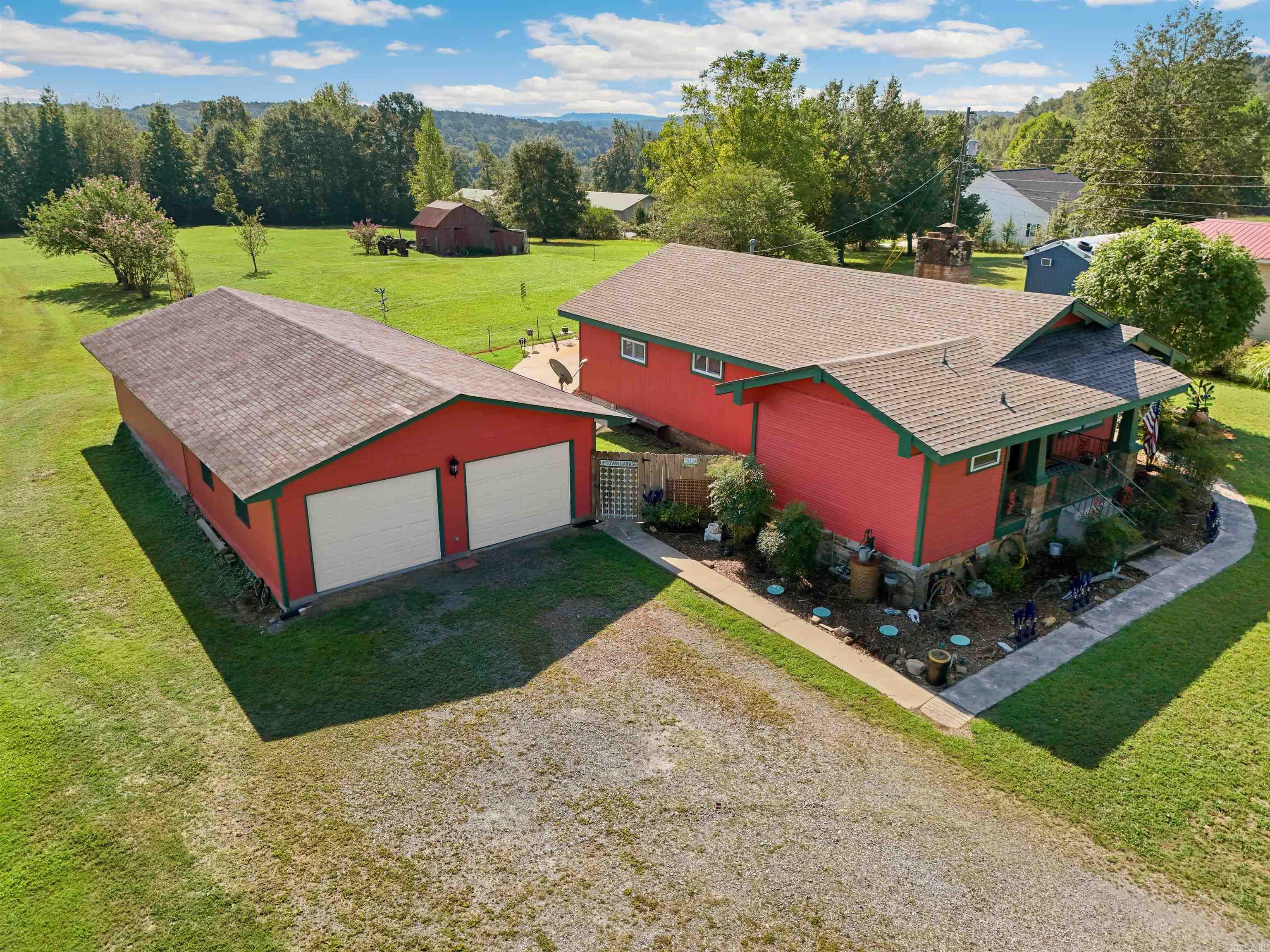So many possibilities with this one! Looking for a charming home with a large shop on land? This is it! Looking for potential commercial property to make your dreams come true? Look no further! See aerial drone footage and 3D tour to help your vision come to life. Shop is 52' x 24' (1248 sf). New roof in 2023, interior shop and garage rebuilt 2023, and shop was recently upgraded with complete new electrical 220 and heat/air. The yard has extra landscaping and has been well maintained. Agents, see remarks for more info. Call for your showing!