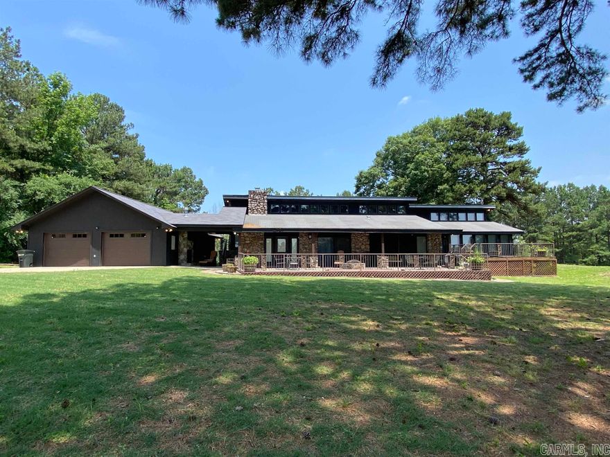 What an opportunity! Custom built home, approx. 12 acres, large pond and shop building, close to Diamond Mine and Lake Greeson.  Home offers over 2,500 sq. ft of living space including: 4 bedroom and 2 1/2 baths, living room w/cathedral ceilings and a rock fireplace with gas logs, dining area, kitchen w/breakfast bar, walk in pantry/laundry room, built-in oven, built-in microwave, refrigerator, electric stove top and dishwasher.  The master suite has a rock fireplace, cathedral ceiling and separate den and access to back deck, master bath has update walk in shower, double vanities and walk in closet.  Half bath located off living room, additional bedrooms share a jack-n-jill bath w/access to back deck as well.  Home offers large entertaining patio, fire pit and separate intimate sitting area that has a fireplace, double garage with safe room and cabinets for storage.  Separate shop building, NG-powered electricity back up generator, metal two car shed, iron fence w/ electric access gate, large stocked pond, gazebo and pasture land.  This property offers it all, privacy, security and lots and lots of space.  Contact our office for more details or to schedule your private viewing.