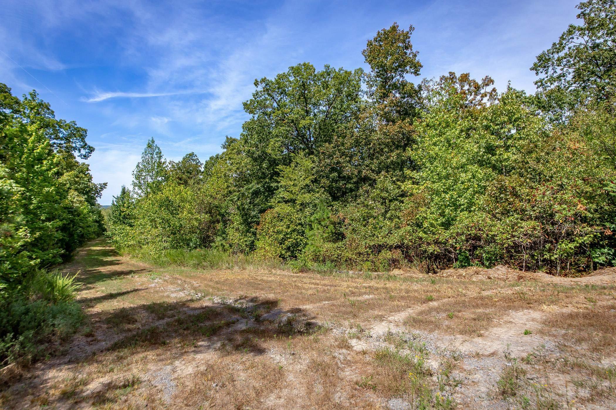Mountain top retreat with a partial cleared pad, good gravel driveway into the property, deer stand, and with a little clearing you will have some amazing mountain views. Power and fiber internet available at the road. You will need a well for a water source. Close to the Middle Fork Little Red River & Greers Ferry Lake. Call today to schedule your appointment.