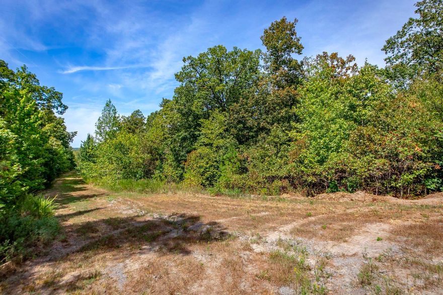 Mountain top retreat with a partial cleared pad, good gravel driveway into the property, deer stand, and with a little clearing you will have some amazing mountain views. Power and fiber internet available at the road. You will need a well for a water source. Close to the Middle Fork Little Red River & Greers Ferry Lake. Call today to schedule your appointment.