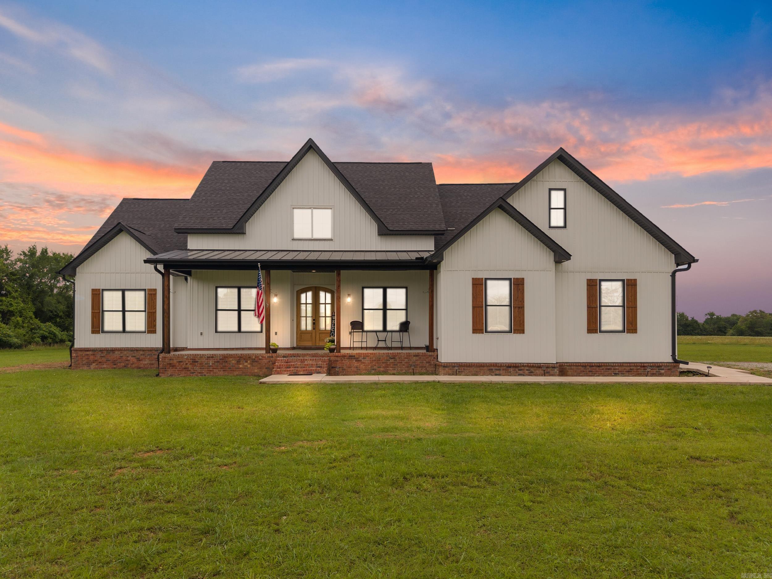 Discover the perfect blend of modern living and country charm on this expansive 19+ acre property featuring a stunning 3,294 sq ft home built in 2023. This thoughtfully designed home offers 4 spacious bedrooms, 3.5 bathrooms, an upstairs bonus room with it's own full bath and closet (making it a great option for a 5th bedroom), and a dedicated office space-ideal for remote work or a quiet retreat. Inside, you'll find luxury vinyl plank flooring throughout main living areas. The kitchen features granite countertops, a gas range and convection oven, and ample cabinetry and a butler's pantry. The natural light creates a warm and inviting atmosphere! The back porch is prepped for an outdoor kitchen with a gas outlet and hot/cold water connections. Thoughtful details continue with under-soffit electrical outlets, ideal for seasonal lights! Toward back of property, the shop features plumbing, septic, cabinetry, a sink and bathroom. With a little TLC, this space could be reimagined into whatever you need! There is a 50 amp RV hookup as well! While a driveway has not yet been installed, this allows flexibility to design what best suits your preferences and material of choice!