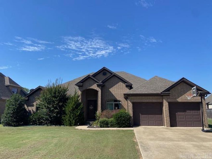 This charming traditional home sits on over half an acre, offering plenty of space for outdoor fun, gardening, or simply relaxing in the open air. Inside, the inviting floor plan features a large living area that seamlessly flows into the dining room and kitchen perfect for gatherings and everyday family living. The primary suite is a true retreat, boasting a luxurious bath with both a soaking tub and a walk-in shower, plus two generous walk-in closets for ample storage. A versatile bonus room provides the ideal space for a cozy den, home office, or children's playroom. Throughout the home, beautiful stained concrete floors add warmth, character, and easy maintenance.
