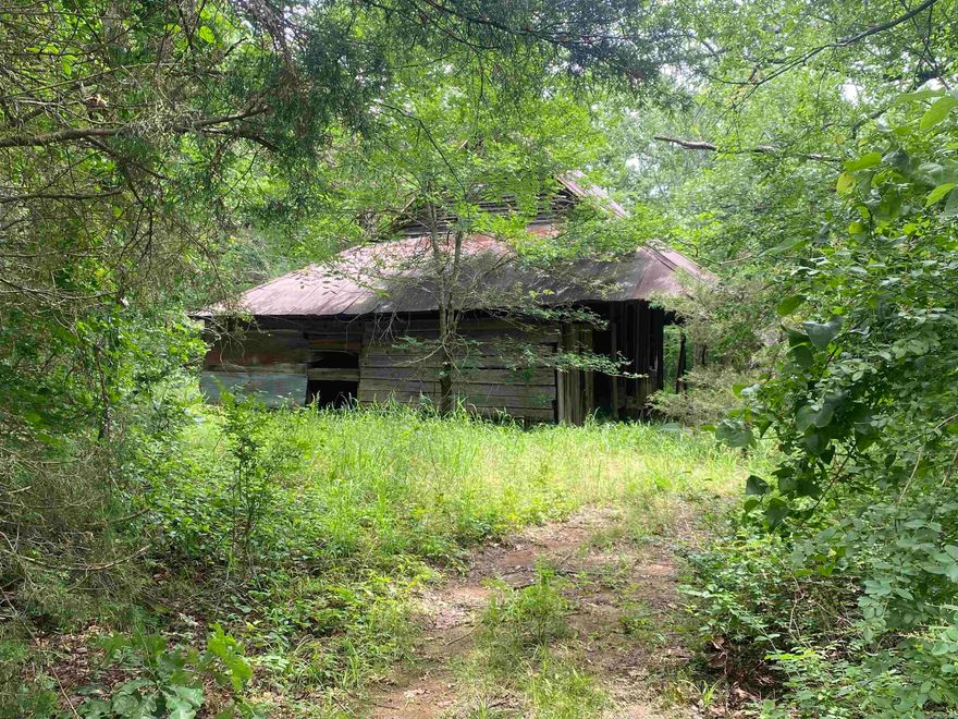 Acreage available!  Build a cabin or home on this 4 acres m/l parcel in the Pencil Bluff/Sims community! Large, undisturbed trees of all kinds!  This property is across Stevenson Road from several hundred acres of Ouachita National Forest and not far from the Ouachita River.  Property features an older barn structure and small pond with a wet weather creek. Call today! $39,200.00 There are two 4 acre parcels that can be purchased as a whole. The whole parcel is MLS #25020620