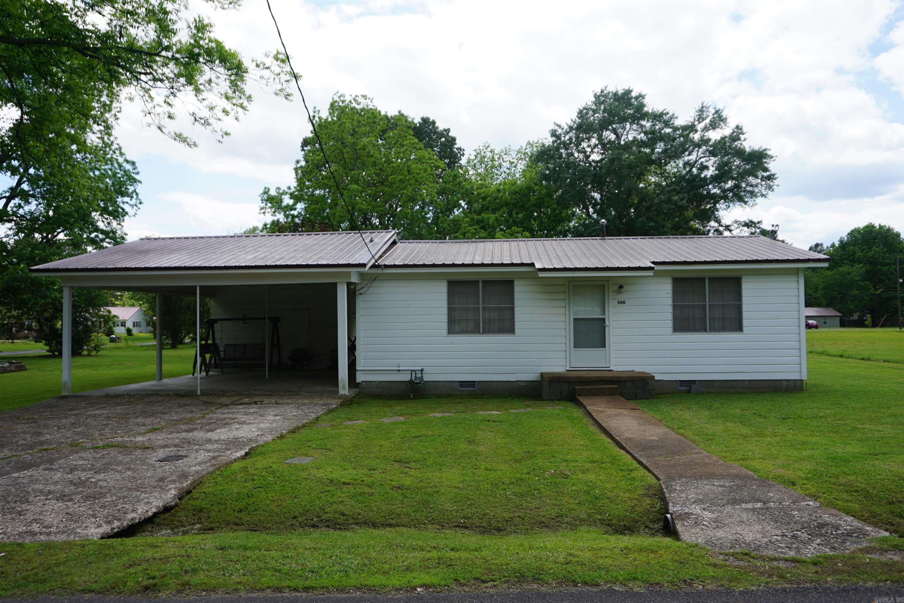 Very well cared for home sitting on almost 1/2 acre. The living room is a great size and opens into the large eat in kitchen with plenty of room for a large dining table. There are 2 bedrooms and 1 bath in the main part of the house and then in the addition there is a gigantic bedroom with a large closet, a full bathroom and a door that goes out into the back yard. This space could also be used as a 2nd living room if you dont need 3 bedrooms. There are 2 parcels included with this property. The roof was put on in 2015. CH&A is currently not working in the addition. Window units will stay and there is a wall furnace in main part of the house. Selling as is.