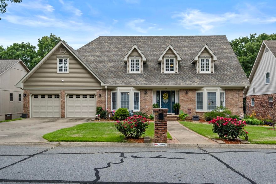 Welcome to Overbrook Subdivision. This well-designed home offers 5 bedrooms, 3 full baths, and 2 half baths with space for work, play, and relaxation. The main level features oak wood flooring, an office, formal dining room, updated kitchen, and a great room centered around a gas log fireplace. The primary suite is conveniently located on the main floor with a walk-in closet and en-suite that includes a double vanity, soaking tub, separate shower.  Upstairs you’ll find three bedrooms, one and a half bathrooms, and a large walk-in attic that could easily be finished out for added living space. The lower level includes a bedroom, den and a full bath. This bedroom is currently being used as a game room.  There is also a workshop (this is a handyman's dream).  Outdoor living is enhanced with a covered porch on the main level and a deck on the bottom level, overlooking a private backyard surrounded by mature trees. Updates include an architectural shingle roof approximately six years old and HVAC units replaced in 2023 and 2014.  This home is perfect for a large family.  There is plenty of room to spread out.  Call today for your private tour.
