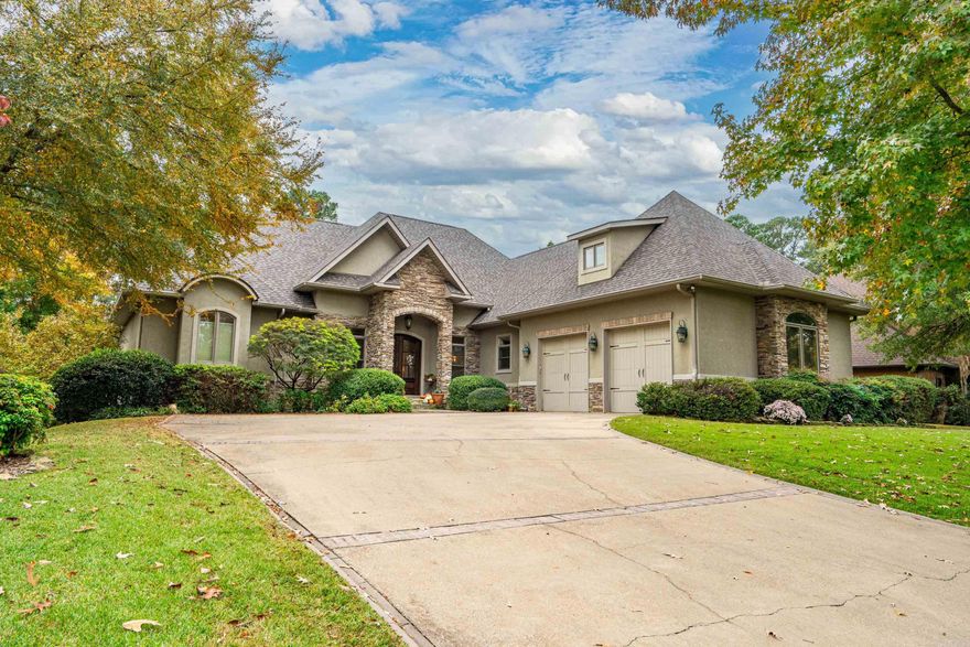 Discover 446 Lotus Loop — a beautifully landscaped home located in one of Hot Springs’ premier neighborhoods within the award-winning Lakeside School District. This elegant property combines comfort, style, and resort-style amenities, offering the perfect retreat just minutes from Lake Hamilton and all the conveniences of town. Step inside to find a bright, open floor plan designed for easy living and entertaining. The spacious living area features large windows that fill the home with natural light and provide lovely views of the backyard oasis. The kitchen offers plenty of cabinet and counter space, modern appliances, and a functional layout ideal for family meals or gatherings with friends. The primary suite serves as a private retreat with a generous closet and ensuite bath, while additional bedrooms offer versatility for guests, family, or a home office.Step outside to your own backyard paradise! Enjoy the sparkling in-ground pool, relaxing hot tub, and lush landscaping that create a truly serene outdoor living experience. Multiple seating areas provide the perfect setting for entertaining or simply unwinding after a long day.