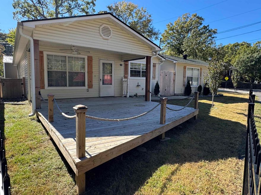 205 Kleinshore Drive | Lake Hamilton (70 West Area) Warm, welcoming, move-in ready, this beautifully maintained 3 bed,2bath home offers a thoughtfully designed split floor plan with an open-concept living area that feels both comfortable & connected.The open kitchen features a breakfast bar that keeps everyone included, whether you’re preparing a quiet meal or entertaining friends. It flows seamlessly into the living room, which opens onto a spacious covered porch-an ideal spot to unwind and take in peaceful views of Music Mountain & Lake Hamilton. 2 bedrooms & a full bath with a tub/shower combination are tucked down the hallway, creating a cozy retreat for family or guests. On the opposite side of the home, the primary suite offers privacy & relaxation with a walk-in closet & a private bath featuring a soaking tub-perfect for ending the day. Outside, the fenced yard & convenient doggy door make everyday living easy for pets. A recently added, well-insulated detached garage adds exceptional flexibility.  Mini-split system & beautiful lake views,it’s easy to imagine this space as a guest suite,game room,studio,or workshop.This property offers comfort you'll love coming home to.