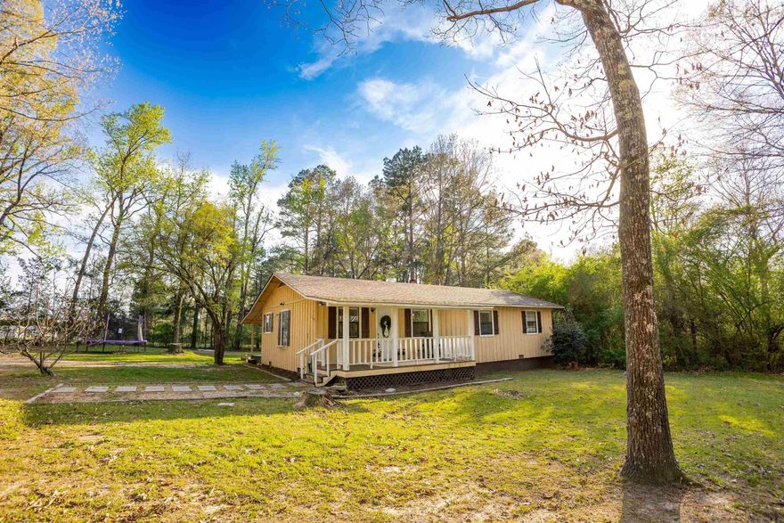 217 Parks Drive- 1.55 acres, cozy cottage charm, and a setting you'll fall in love with. Huge yard, front and back porches made for realxing, and tons of potential-- all just minutes from El Dorado and Parkers Chapel.