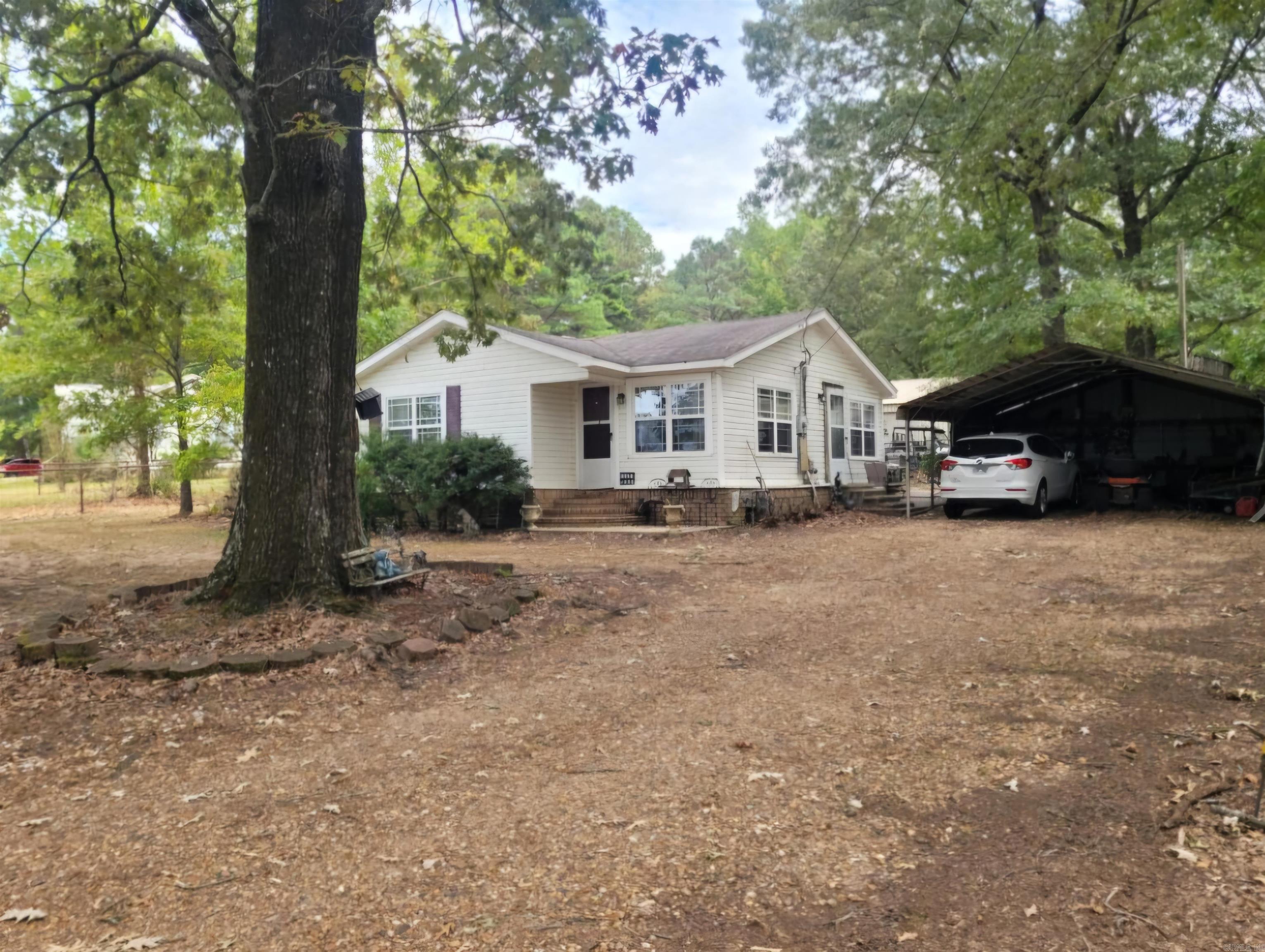 Welcome to this adorable country-style home located just south of Monticello on Highway 425. Nestled on approximately 3 acres with highway frontage, this property offers a perfect blend of comfort and convenience. Property Features: ⢠2 Bedrooms, 1 Bath ⢠1,303 sqft of Living Space ⢠Spacious, naturally-lit living area with beautiful laminate flooring ⢠Retro-themed kitchen full of character and charm ⢠Large utility room for added convenience ⢠One bedroom currently set up as a craft room and storage, but can easily be converted back into a spacious bedroom ⢠Fully fenced backyard with a concrete patio, perfect for summer evenings or cozy fall nights by the fire pit ⢠Detached two-car metal carport Shop & Workshop: ⢠40ft x 50ft Metal Shop built on a solid concrete slab ⢠3 large bay doors and 1 walk-through door for easy access ⢠Plenty of room for a workshop, storage, or housing vehicles, boats, UTVs, or any other toys ⢠Ideal space for a hobbyist or business owner looking for extra space Additional Land Features: ⢠The back side of the property features a small field, previously used for horses Contact us today for a tour and make this charming home yours!