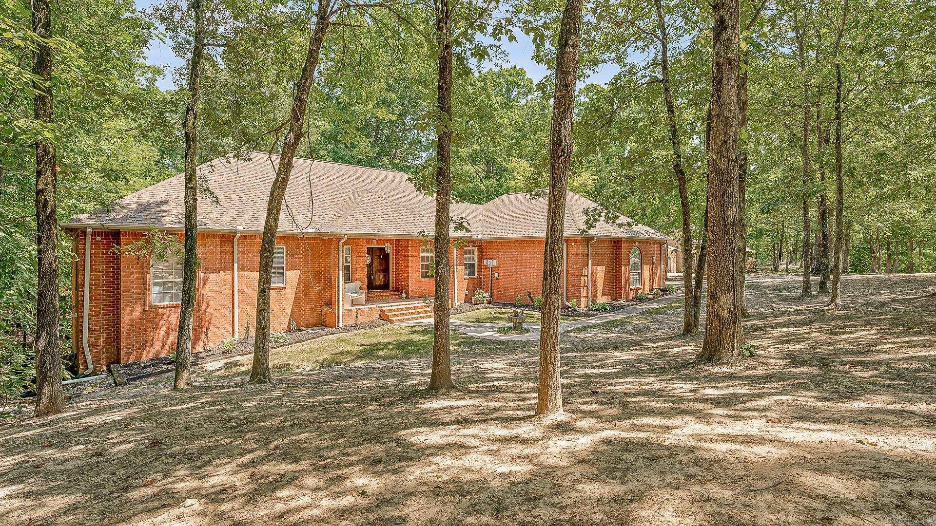 This impressive 6-bedroom, 4.5-bath home offers nearly 5,000 square feet of living space on 1.5 beautifully shaded acres. Inside, you'll find three spacious living areas, a walk-out basement, and a versatile bonus room that is perfect for a game room, home theater, or guest space. The eat-in kitchen flows seamlessly into a formal dining space, providing plenty of room for everyday living and entertaining. The primary suite is a true retreat, complete with a private office, and a recently updated spa-like bathroom featuring a tiled walk-in shower and a freestanding tub. Additional updates throughout the home include a new roof, fresh paint, updated flooring, and modern lighting. With space, function, and style in all the right places, this home offers the perfect blend of comfort and sophistication.