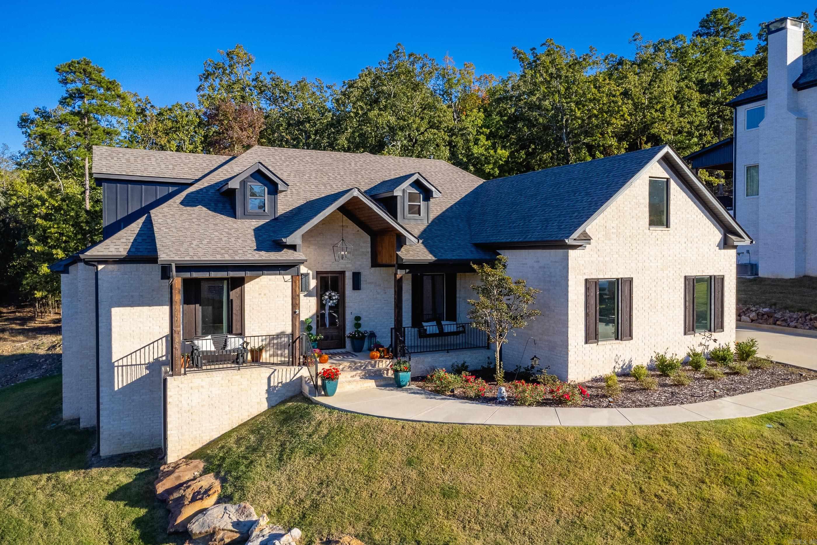 Located in the sought-after Waterview Estates, this beautiful 4-bedroom, 3-bath home offers the perfect blend of luxury, comfort, and privacy. With 3,300 square feet of thoughtfully designed space, this property backs up to peaceful woods, offering stunning views. The light brick exterior with warm wooden accents gives the home timeless curb appeal, while the spacious front porch provides an inviting spot to relax and enjoy the neighborhood atmosphere. Inside, youāll find an open floor plan filled with natural light and a modern kitchen thatās both stylish and functionalācomplete with premium finishes, ample storage, and seamless flow into the living area. A bonus space upstairs offers flexibility for a game room, media room, or home office. The primary suite is a true retreat, featuring a large walk-in shower and a soaker tub, large window and an oversized walk-in closet. Step outside to the covered deck overlooking the wooded backdropāa perfect setting for outdoor dining or quiet mornings with a cup of coffee. Additional features include a three-car garage and access to the many neighborhood amenities such as basketball and tennis courts, green spaces, and a gated entrance.
