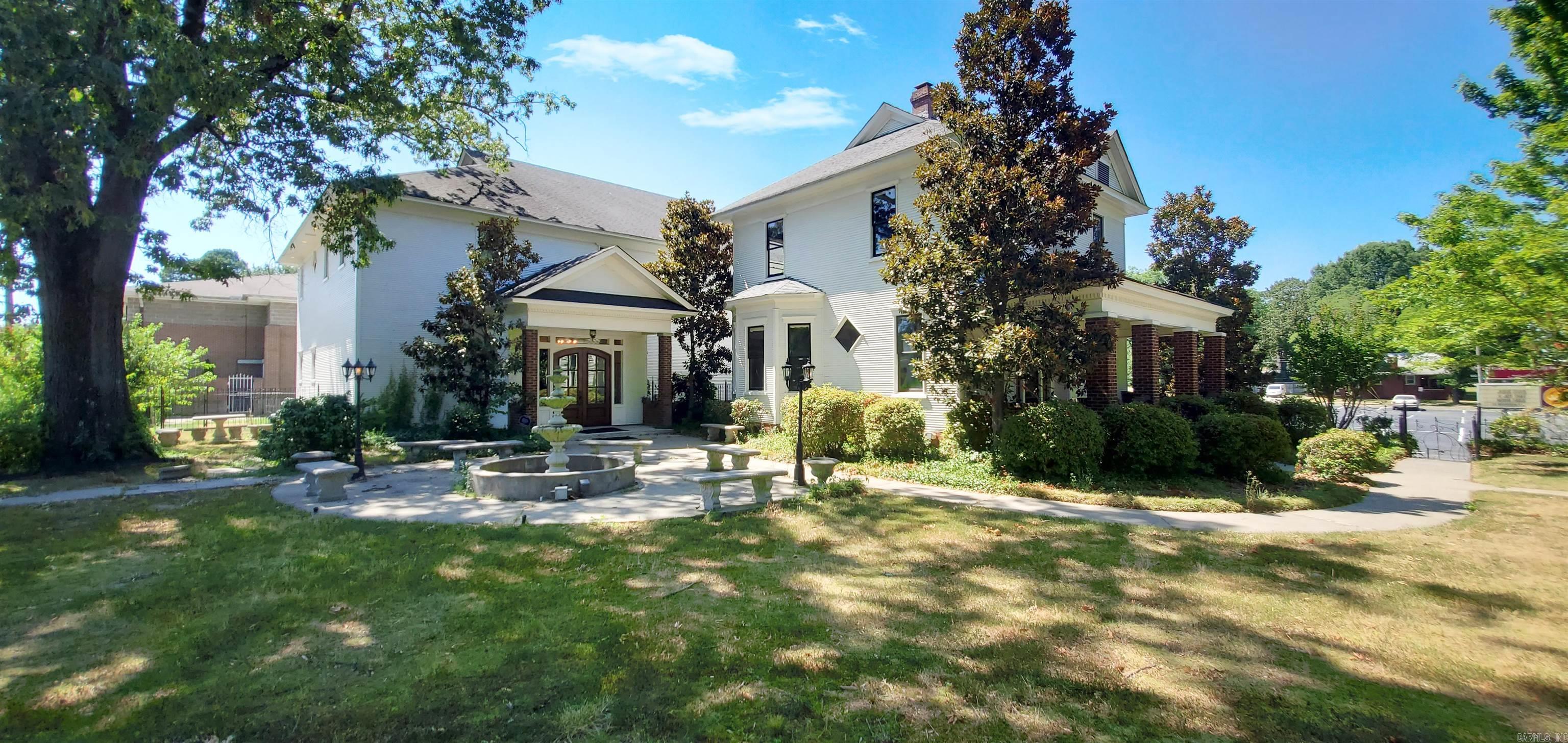 Turnkey Event Center/Venue! This historic property offers a unique opportunity for a variety of uses, including a Bed & Breakfast, office space, or a fully equipped event center. The main home is approximately 2,000 square feet, showcasing classic charm and character. The adjacent event center, built in 2009, spans around 6,000 square feet, offering ample space for large gatherings such as weddings, meetings, and reunions. Upon entering, guests are welcomed into a stunning two-story building featuring hardwood flooring, intricate molding, and elegant chandeliers. The expansive grounds provide a picturesque setting, perfect for capturing beautiful photographs. The historic home is ideal for office use, with its prime location right on Main Street in North Little Rock. Event center is fully equipped with tables, chairs, tablecloths, fully equipped commercial kitchen, bride's room, sound system and more. Agents see remarks.