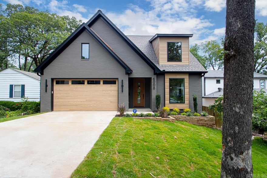 Custom quality home in Cammack Woods. Primary + guest BR's on lower level w/ 2 1/2 baths down. Top of the line appliance package w/ side by side refrigerator & separate icemaker. Wonderfully large walk-in pantry. Spacious quartz work island/breakfast bar. Dry bar w/ beverage cooler downstairs. All appliances included. The ideal kitchen/living/dining  entertainment center. Big windows offer abundance of natural light.  2nd BR & B down also idea for office, small child or older family member (walk in shower in bath).  2 large bedrooms up each w/ private baths + a family room up w/wet bar & under counter refrigerator.  Access to walk in attic storage. Outdoor porch designed for gatherings w/fireplace and built-in grill.  All the extras included!! A great floor plan & the finest custom features!