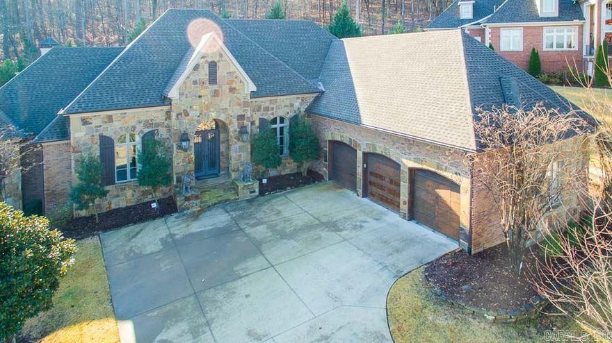 Stately European architecture in newer gated Hickory Creek. Quiet cul-de-sac, private and peaceful. Native AR stone exterior w/stone wall water feature in tranquil backyard. Open living lives like a one level- 3 living areas. Versatile floor plan w/18'x30' media room, additional bedroom/exercise. Wood paneled study, large master suite w/fireplace and sitting area. Complete chef's kitchen, plantation shutters, coiffered ceiling and whole home generator. New roof 2014. Unbelievable value. Don Roberts School.