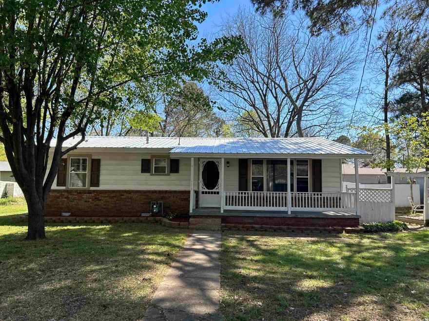 Welcome to your new Home Sweet Home! What a charmer this one is! First of all, the exterior premises offers so much such as a large carport outside, large storage shed with electricity, brand new metal roof on home and carport, storm cellar, and an adorable front porch. As you step inside this charmer, you are greeted by a spacious living room. Kitchen area is also very spacious, includes a pantry, new garage disposal, newer appliances (all convey) and a door leading to the carport. Two of the bedrooms are very large, the third could be a kid's room or home office space. Sets on a large lot! You will not find a home like this for this price- Priced to sell!  Brand new washer and dryer convey! HVAC is a package unit - about 15 years old. It has a stainless-steel heat exchanger, which will not rust! You will never run out of hot water with that huge hot water heater!  Home is currently occupied -Please see agent remarks.  Home has been used as a rental in previous years but has been maintained really well. Sq. Ftage is approx. Please Measure. Small corner of the property is in a flood zone. - Please contact listing agent for clarity and a picture!