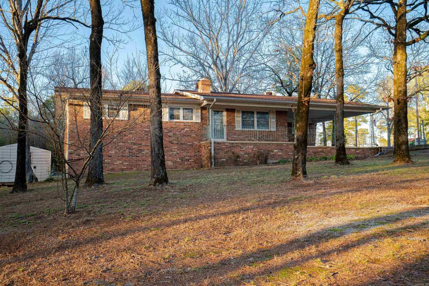 This beautiful two-story home sits on a 1.4-acre lot in a quiet neighborhood. With 3 bedrooms and 2 bathrooms on the upper level and a fully finished in-law suite on the lower level, this family-friendly home offers the perfect option for AirBnB rental. From the open-concept kitchen and living space to the fully finished in-law quarters to the large backyard there is plenty of room for the whole family to enjoy. Recent updates include new carpeting upstairs, tile kitchen and bathroom flooring, and luxury laminate wood flooring. Situated in the Lake Hamilton School District near restaurants, banks, and shopping this home still has a country vibe.